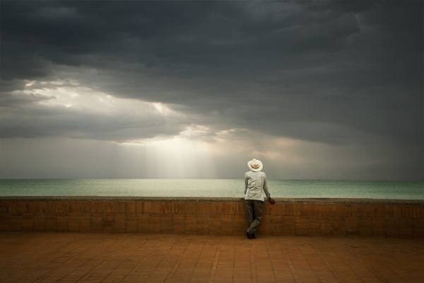 Photograph Eric Prine Man In Cowboy Hat Looking Out At Ocean on One Eyeland